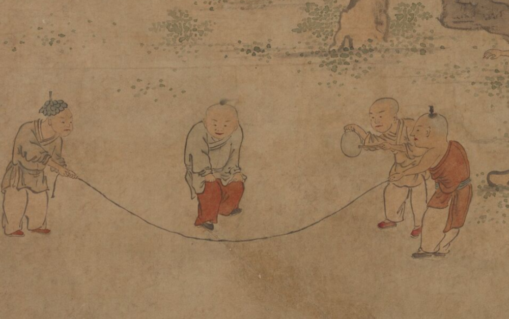 回家的路上,看到街口几个小朋友在跳绳,里面有个小朋友穿的红衣服,又