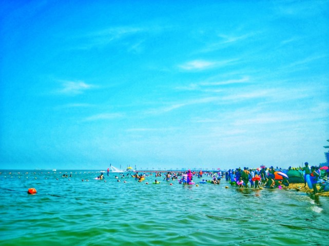 海风抚碧水海浪拥金沙美丽东疆湾东疆湾景区金沙滩