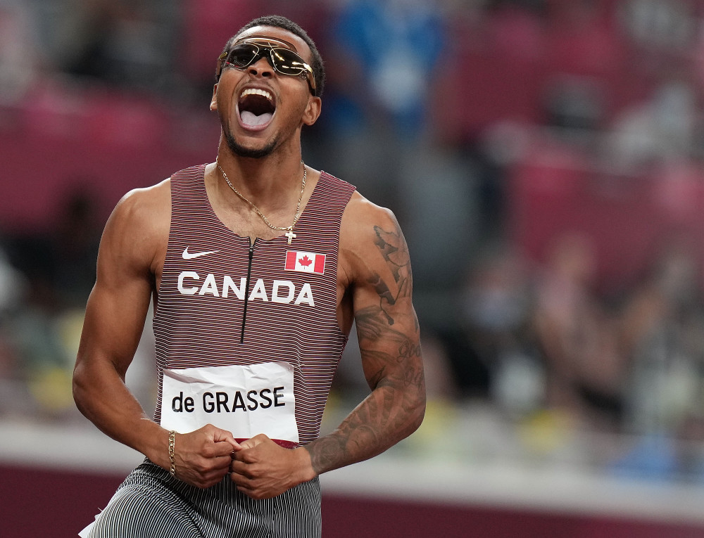 8月4日,加拿大选手德格拉塞在男子200米决赛中.新华社记者 李明 摄