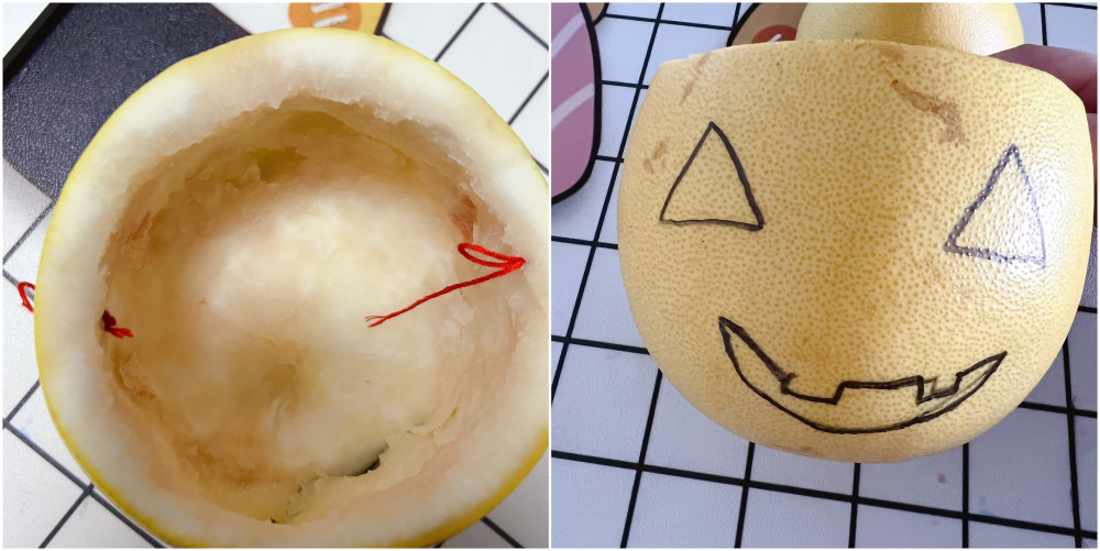 2,挖掉柚子肉,在柚子皮上画出眼睛和嘴巴的轮廓(请忽略俺这拙略的画工