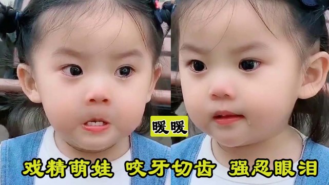 咬着白白的小乳牙,瞪着一双萌萌的大眼睛强忍泪水,就是不走,勾勾的