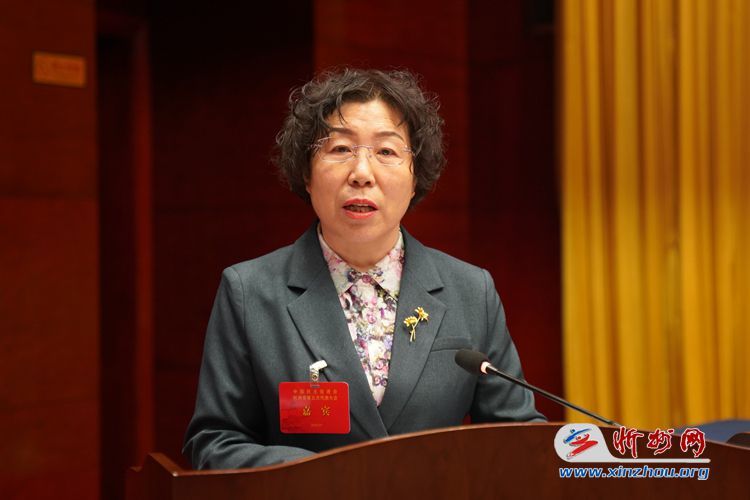 九三学社忻州市委专职主委武志英代表各民主党派,工商