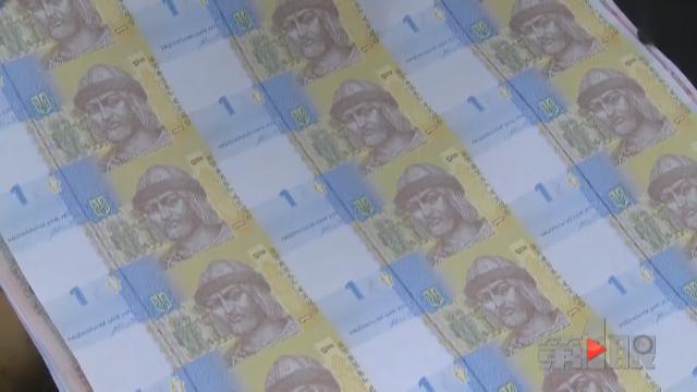 女子花113万投资连体钞 仅值几万元