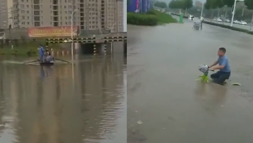 安徽多地遭遇强降雨 指路牌被淹市民划船出行