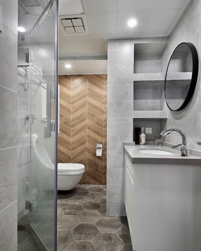 卫生间洗手区设计了壁龛,空间上的最大化利用,搭配上灰调的基础上融入