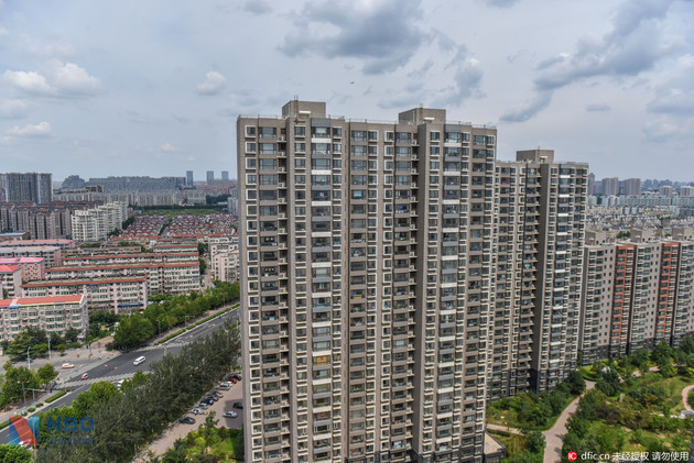“限购”最严的地方，有人一次买了5套房 原因写在售楼大厅墙上