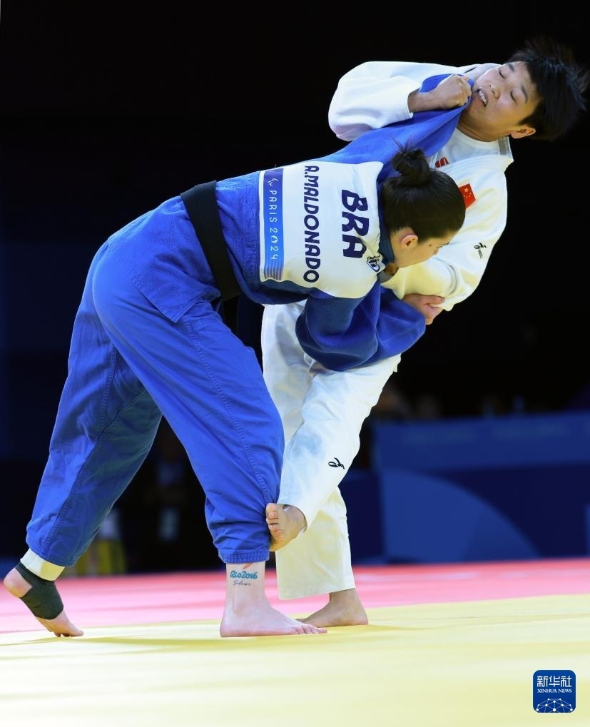 Wang‍ Yue and Maldonado in action