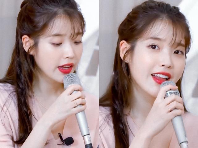 "国民妹妹"iu梳了个公主头十分乖巧,加上空气刘海更显甜美可爱;身穿