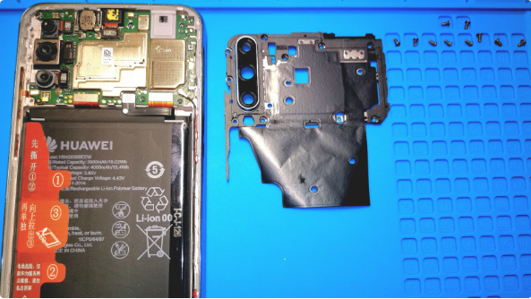 卸下主pcb的盖板总共10颗同规格螺丝主pcb盖板特写有镜头的保护玻璃