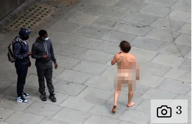 口罩|戴口罩是技术活？全英实行口罩令，这个光着的男人戴在两腿之间