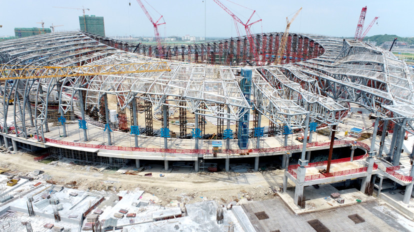 最新进展亚青会主场馆钢结构主体全面封顶