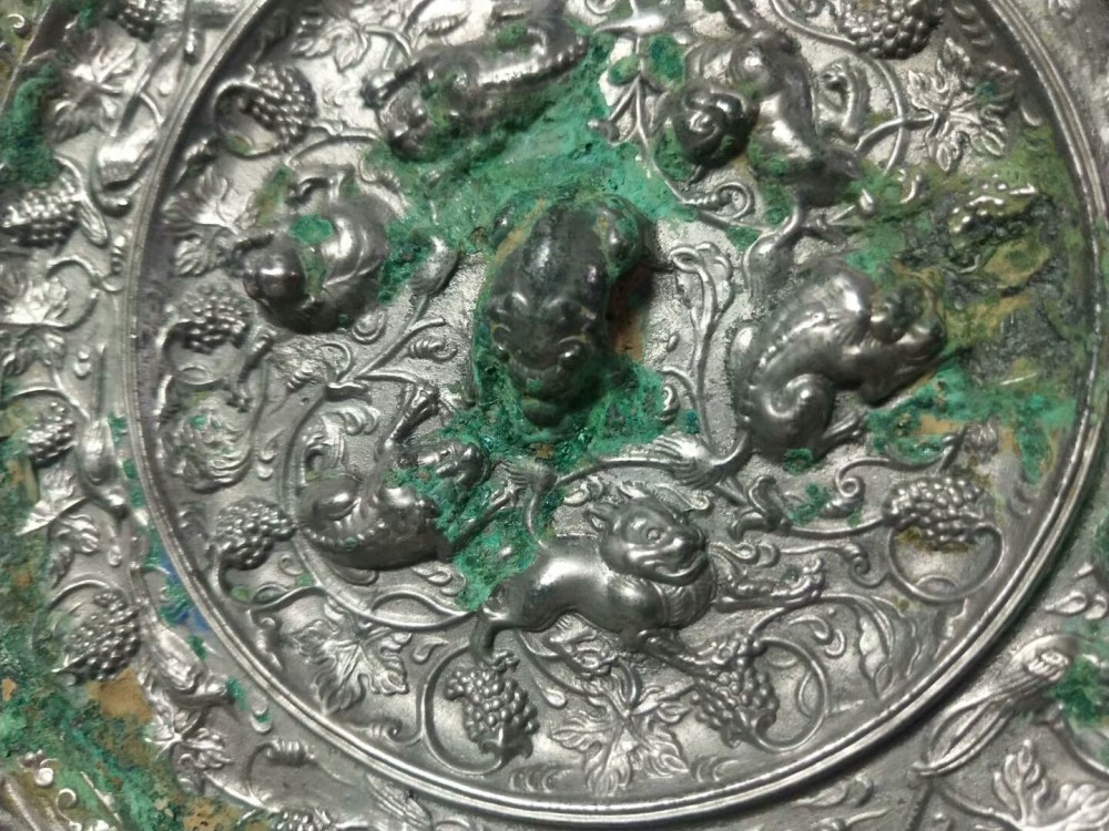 海兽葡萄镜|纹饰凝重精致，工艺繁缛考究，充满神秘色彩的唐代海兽葡萄镜