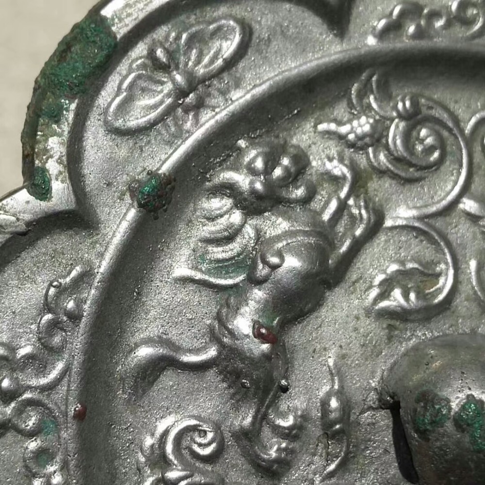 海兽葡萄镜|纹饰凝重精致，工艺繁缛考究，充满神秘色彩的唐代海兽葡萄镜