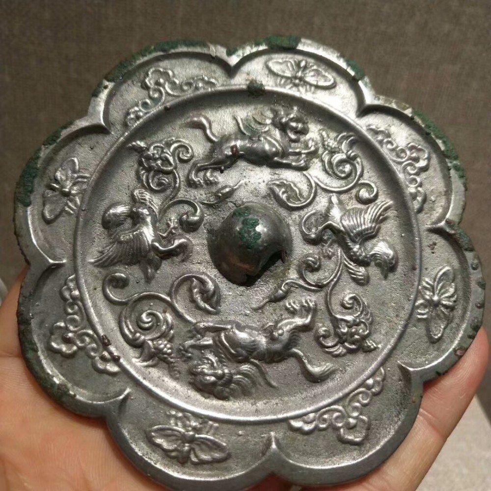 海兽葡萄镜|纹饰凝重精致，工艺繁缛考究，充满神秘色彩的唐代海兽葡萄镜