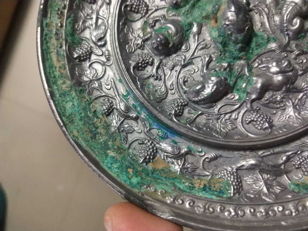 海兽葡萄镜|纹饰凝重精致，工艺繁缛考究，充满神秘色彩的唐代海兽葡萄镜