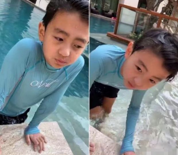 张柏芝|张柏芝三胎后挑战“露脐装”！故意撩开外套秀腹肌，不敢相信她39岁了！