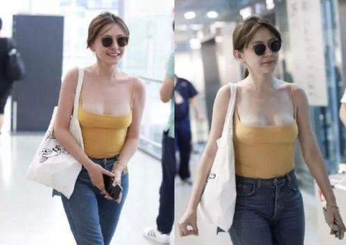 恭喜热依扎,以后再也不是在机场穿黄色低胸吊带的女明星了