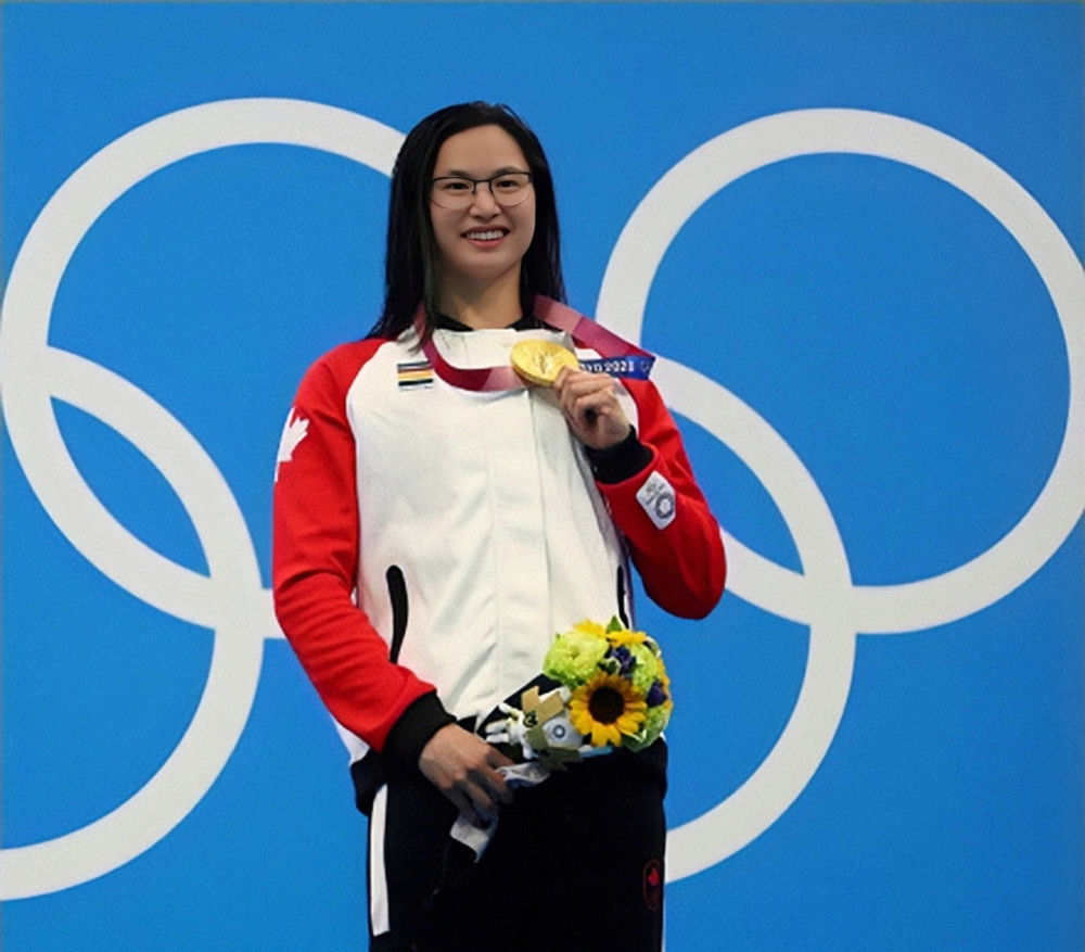 获得金牌的玛格丽特·麦克尼尔蝶泳华裔冠军——麦克尼尔通过加拿大