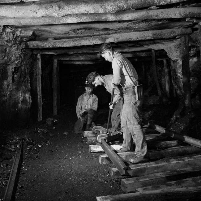 working in a coal mine        
        <figure class=