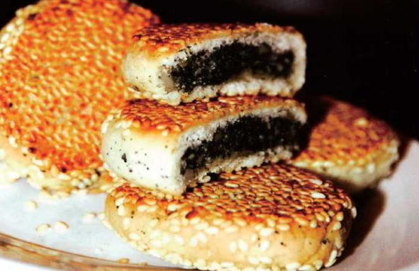 百城百艺非遗名录邵永丰麻饼以双面上麻白炭炉烘烤而闻名