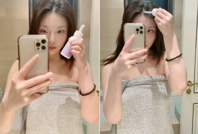 只见她对镜自拍时,身上裹着一条浴巾,露出大片白皙的肌肤.