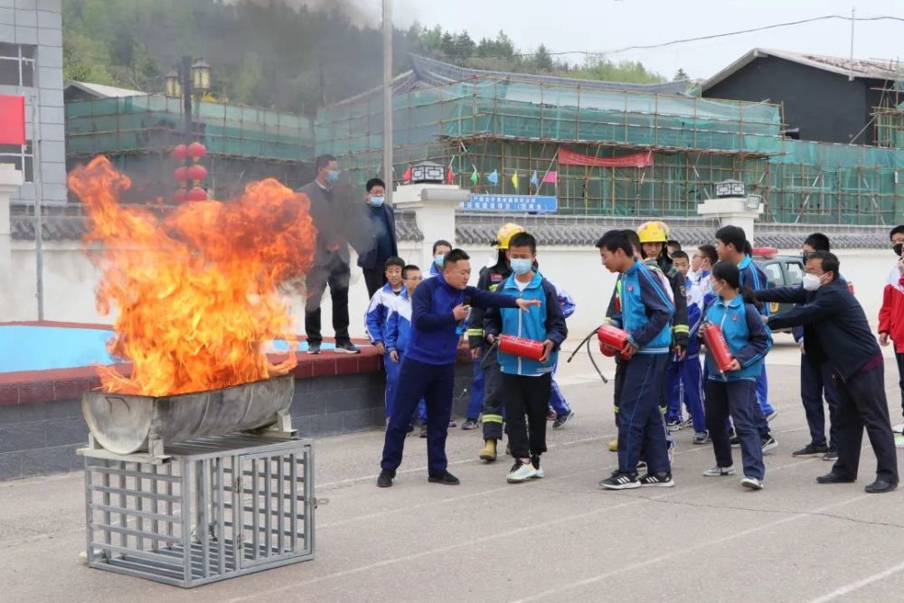 消防安全进校园水洛中学举行消防安全应急疏散演练暨消防技能培训活动
