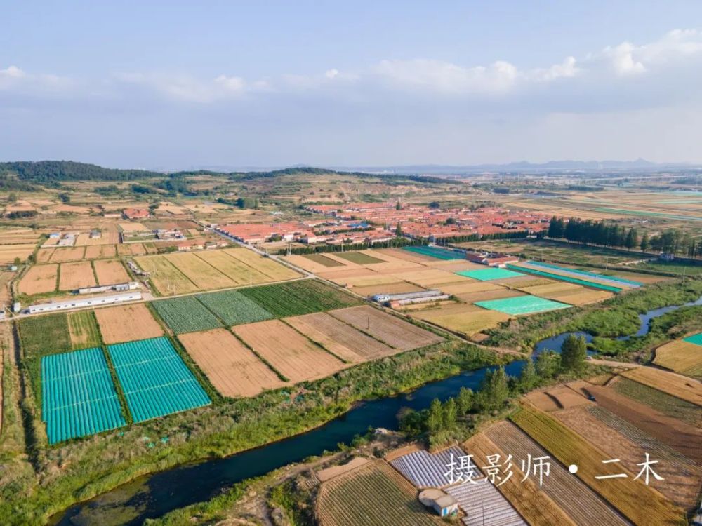 航拍大孤山镇河南村因位于锯河以南得名