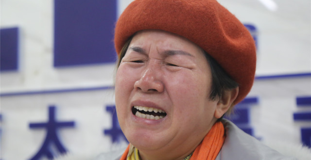 她为儿讨公道带病奔波13载，称心累了就拿出儿子的照片看