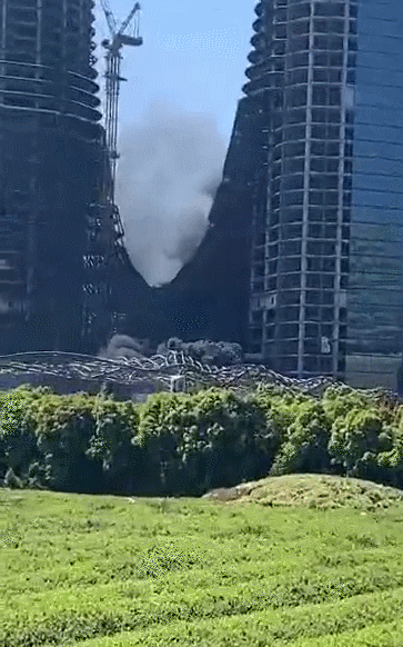 今天中午钱江世纪城杭州之门工地起火现场10分钟内自行扑救完成