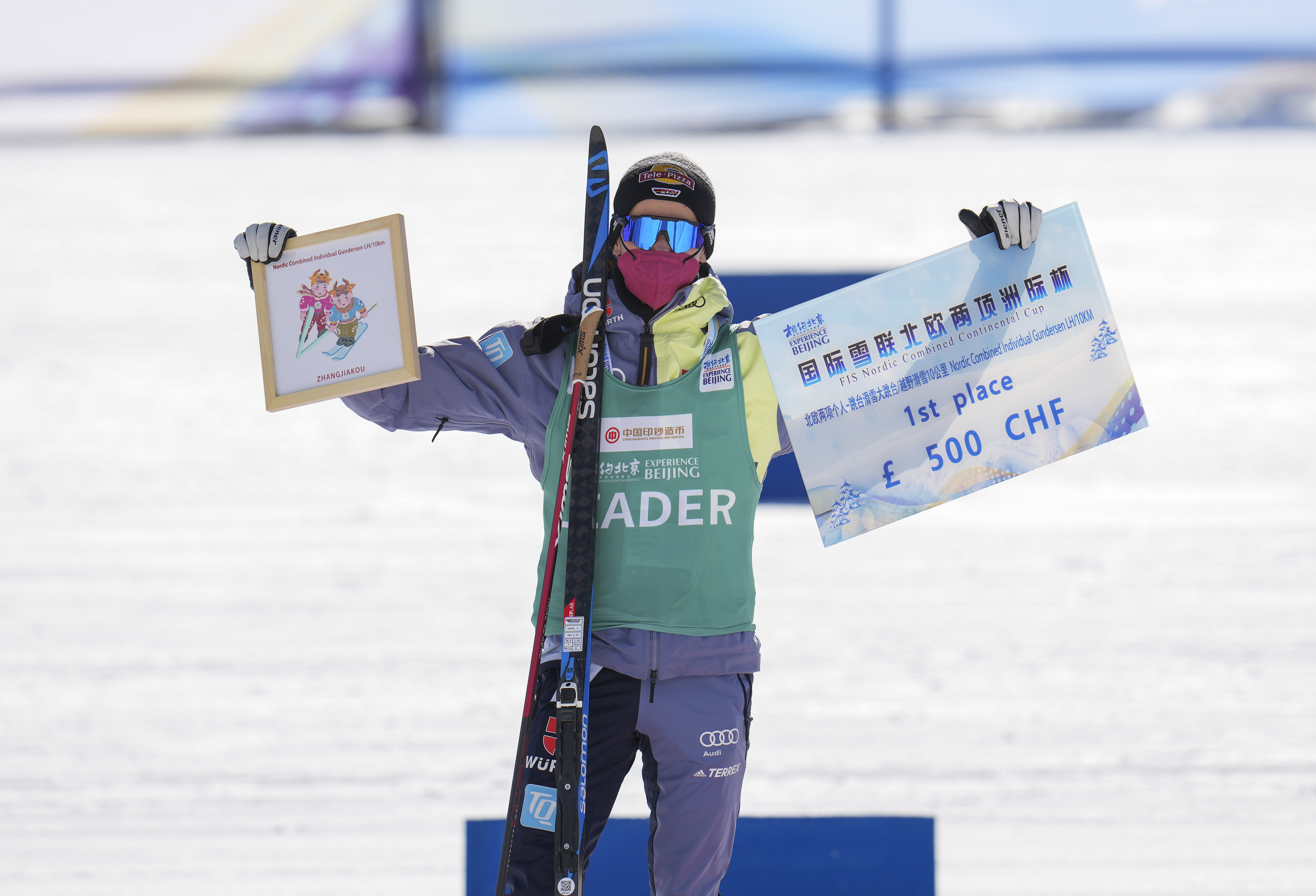 Winner Jakob Lange of Germany celebrates during the awarding ceremony of the men's large hill individual gundersen 10km event of the FIS Continental Cup Nordic Combined, part of a 2022 Beijing Winter Olympic Games test event in Chongli of Zhangjiakou City, north China's Hebei Province, on Dec. 5, 2021. (Xinhua/Hu Huhu)