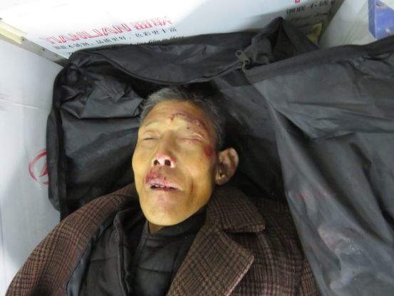 死者为一名男性,年龄60岁左右,寸头,身高178cm左右,瓜子脸,上身穿棕色