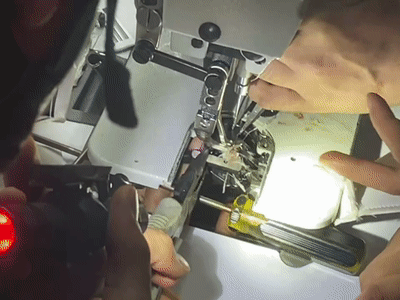 然后利用老虎钳将缝纫机里的抵针剪断再使用扳手把卡住手指上方的铁片