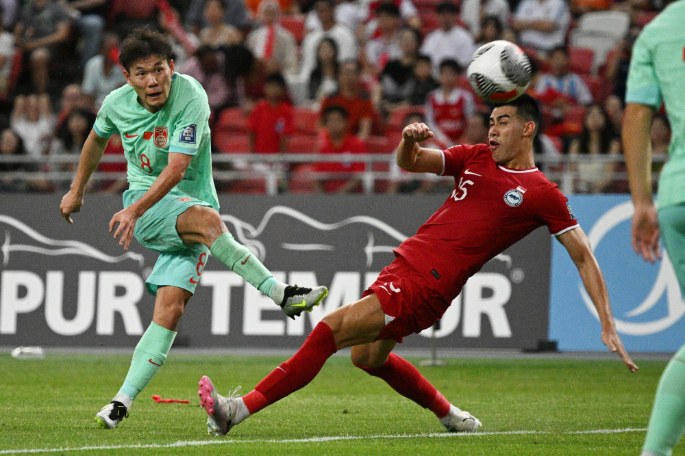 足球世预赛中国队战平新加坡队