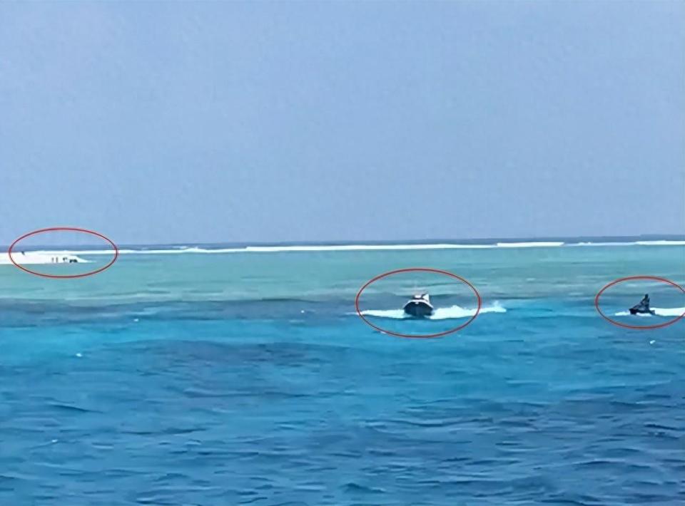 双方没碰面看到中国海警冲过来后菲律宾人立即带着遮阳棚跑了