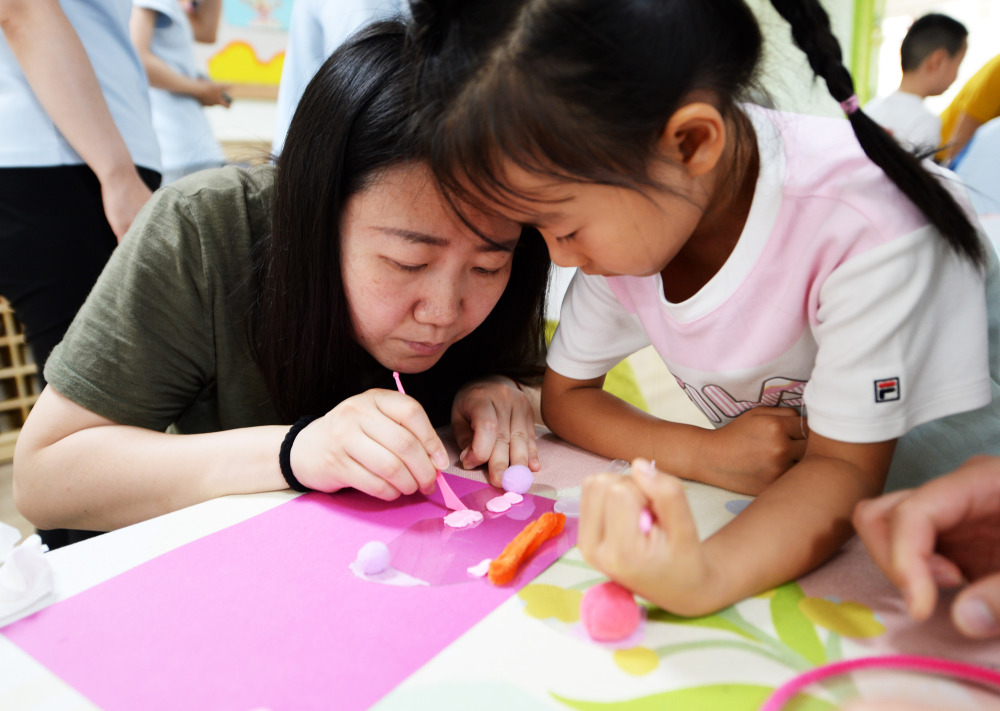 新华社记者 刘勇贞 摄5月30日,北京市第四幼儿园的小朋友们在"六一"