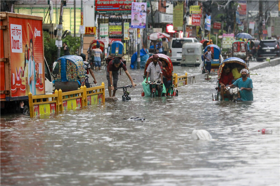 孟加拉国遭遇持续暴雨 街道洪水泛滥_腾讯新闻