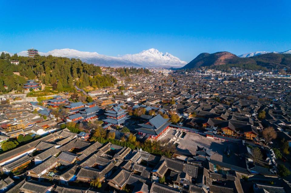 理解城市|保护遗产与发展旅游,丽江古城如何二者兼得?