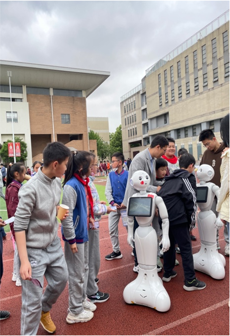 ai点亮童心智能筑梦未来浙财大党员师生走进文海小学科创节