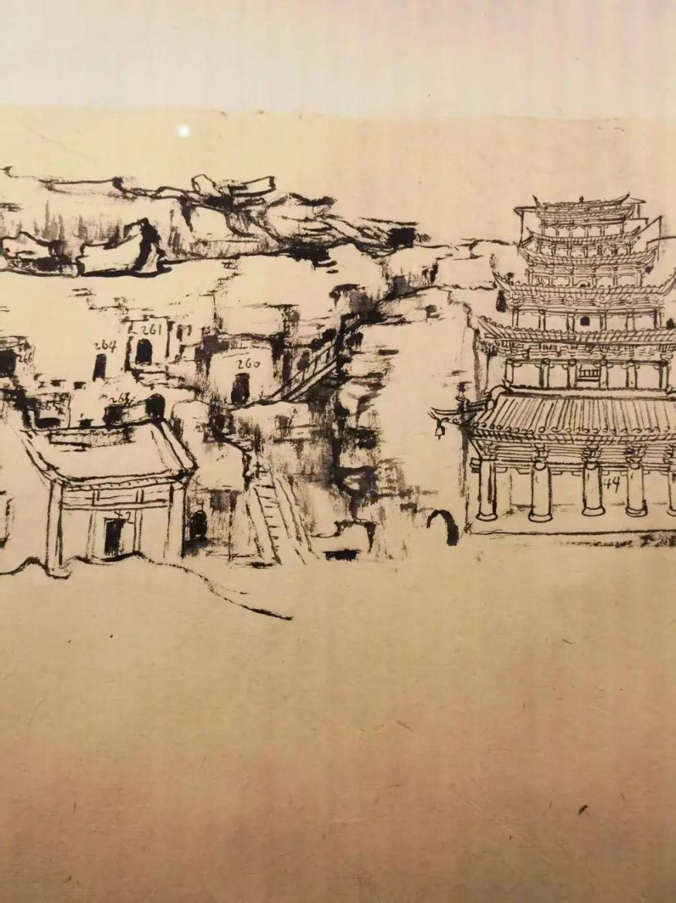 这副数米长的画卷,以水墨速写的手法,描绘了莫高窟南区及北区崖面的