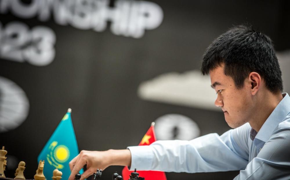 丁立人加冕棋王！人民日报盛赞：中国国际象棋四步走战略终于完成_腾讯新闻